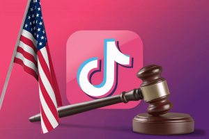 TikTok to challenge US forced sale in court citing constitutional concerns. TikTok logo behind judge's gavel and US flag